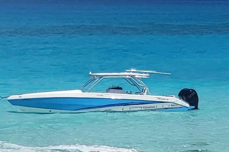 Slide: The Image of 2016 Extreme Boats XC 38 Express on trailer with powerful outboard motors. - 3