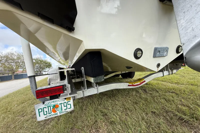 Slide: The Image of 2016 Extreme Boats XC 38 Express on trailer, Florida license plate visible. - 70
