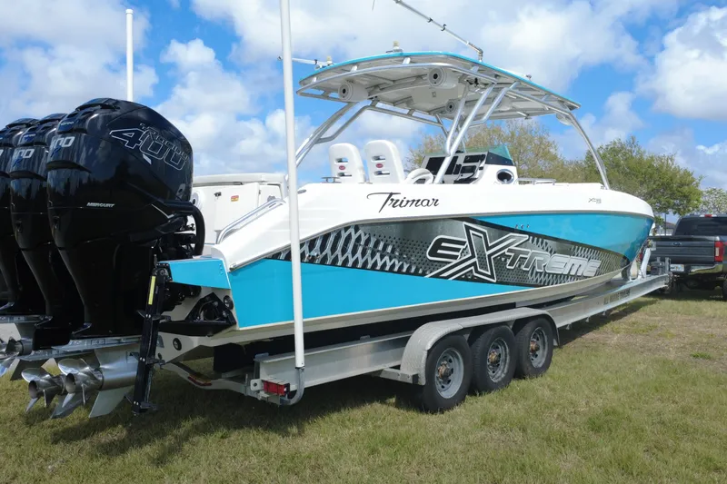 Slide: The Image of 2016 Extreme Boats XC 38 Express on trailer with triple Mercury 400 engines. - 8