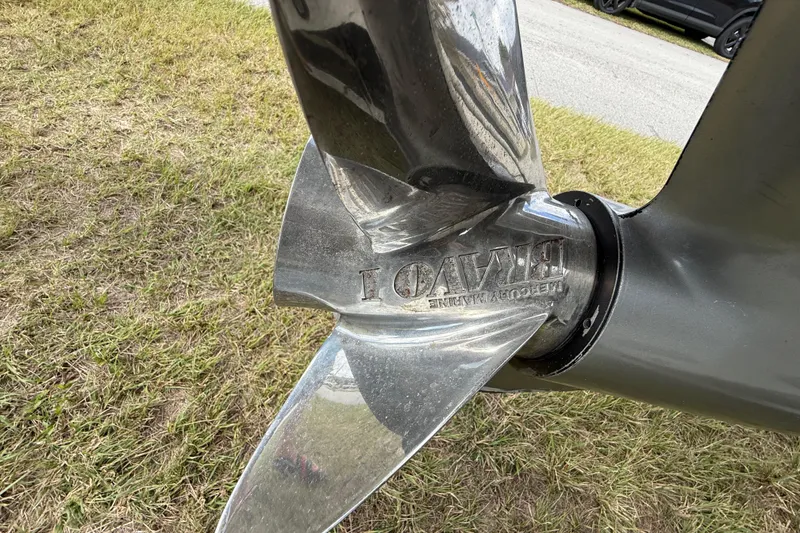 Slide: The Image of Close-up of a 2016 Extreme Boats XC 38 Express propeller on grass. - 82