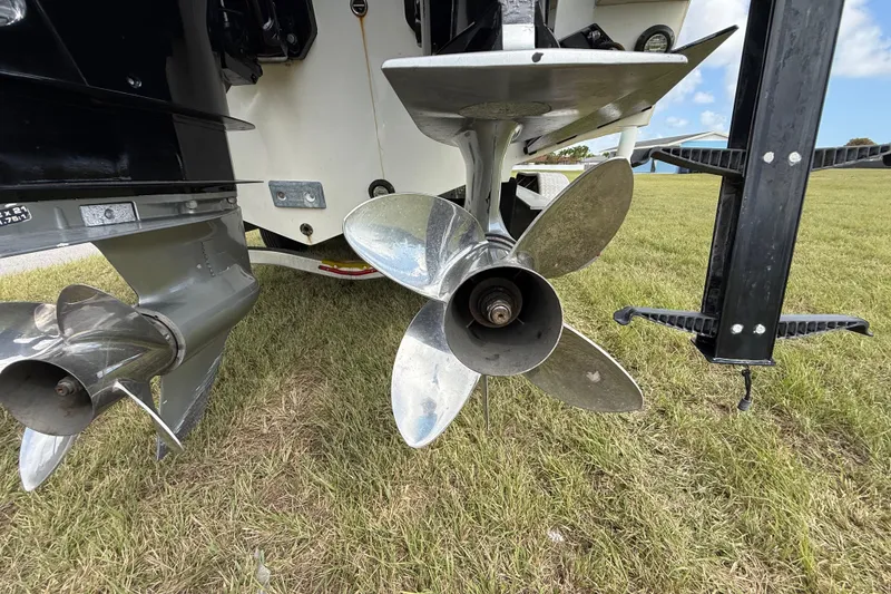 Slide: The Image of Close-up of 2016 Extreme Boats XC 38 Express propellers on grass. - 83