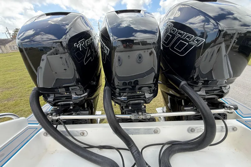 Slide: The Image of Triple outboard engines on a 2016 Extreme Boats XC 38 Express. - 93
