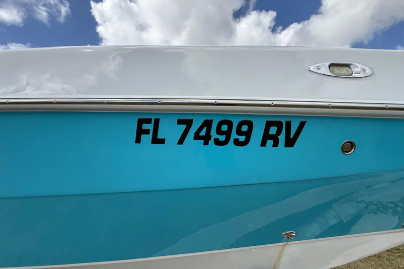 Slide: The Image of 2016 Extreme Boats XC 38 Express with registration FL 7499 RV, blue and white hull. - 96