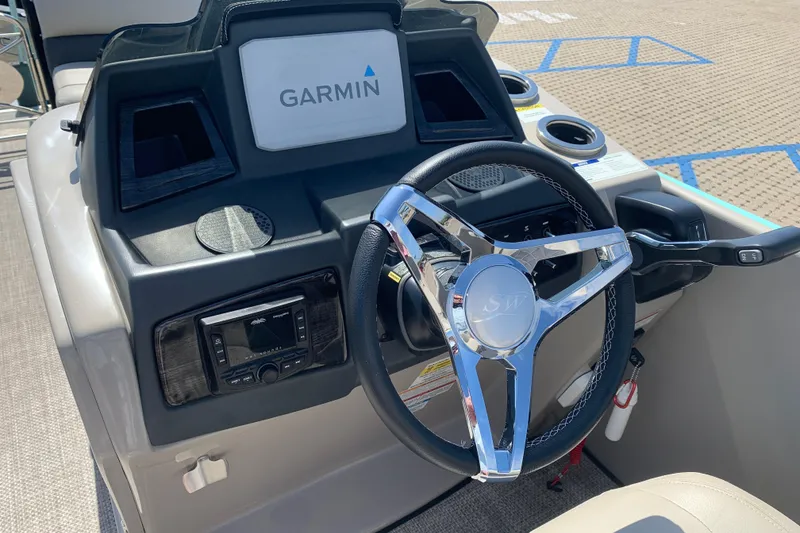 Slide: The Image of 2024 Silver Wave 2210CLS boat dashboard with Garmin navigation and sleek steering wheel. - 10