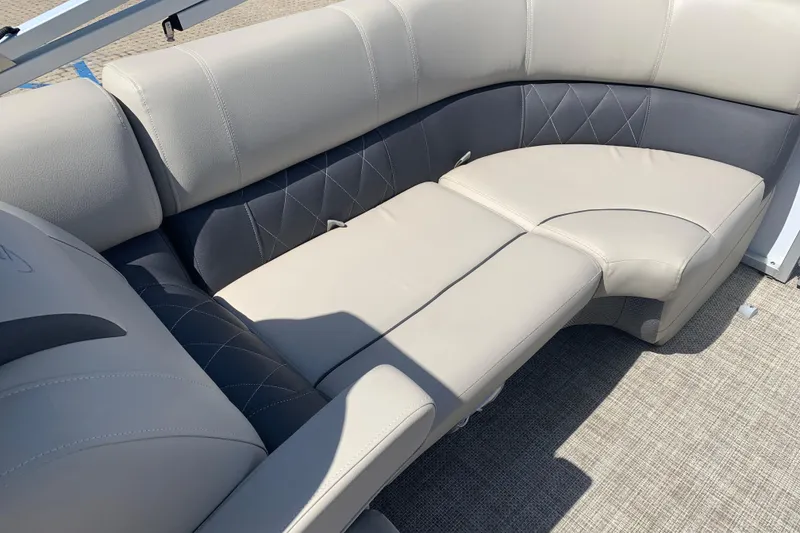 Slide: The Image of 2024 Silver Wave 2210CLS boat interior with luxurious beige and gray seating. - 12