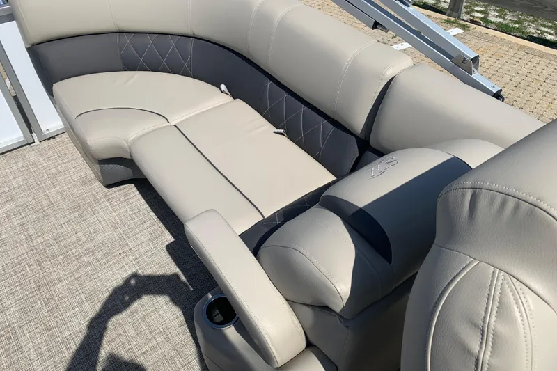 Slide: The Image of 2024 Silver Wave 2210CLS boat interior with luxurious beige seating and cup holder. - 13