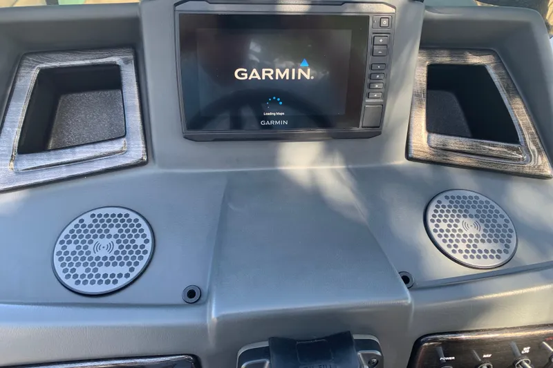 Slide: The Image of 2024 Silver Wave 2210CLS dashboard with Garmin display and speakers. - 28