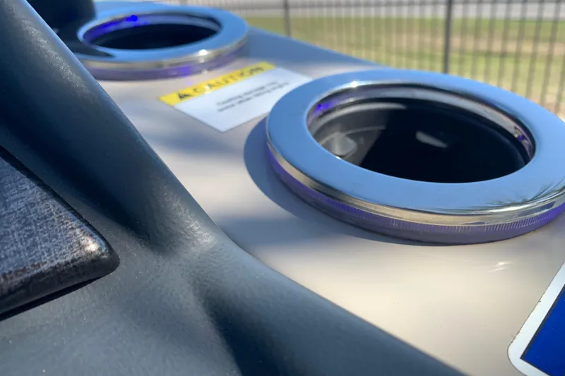 Slide: The Image of 2024 Silver Wave 2210CLS boat cup holders with caution label in sunlight. - 34