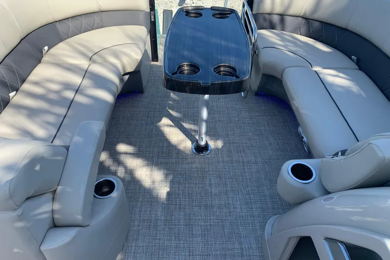 Slide: The Image of 2024 Silver Wave 2210CLS boat interior with plush seating and central table. - 36