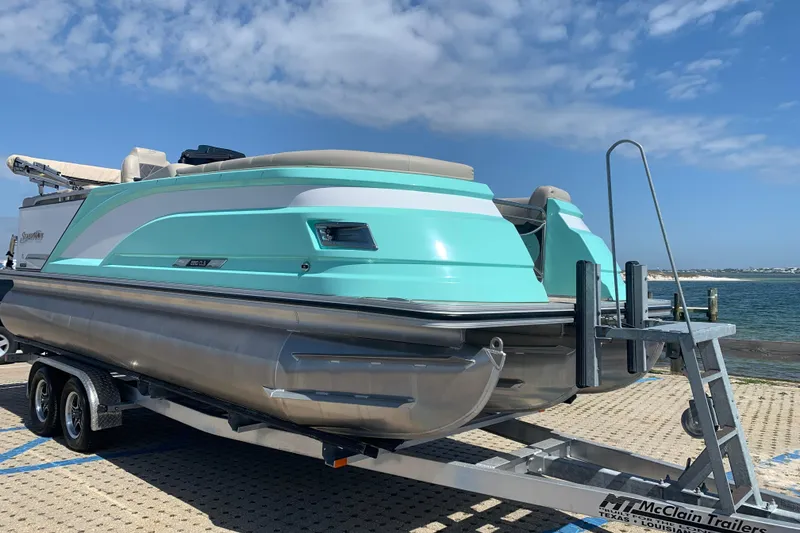 Slide: The Image of 2024 Silver Wave 2210CLS pontoon boat on trailer by the water. - 5