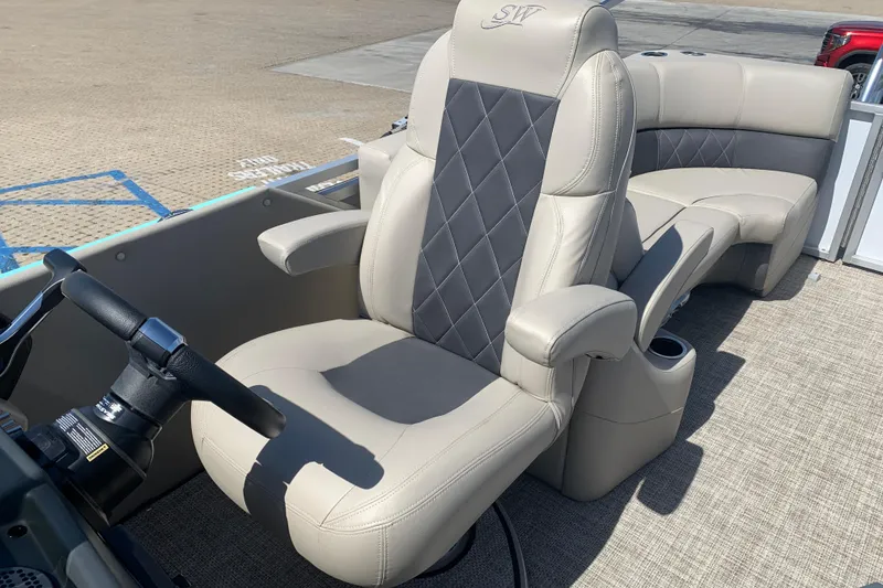 Slide: The Image of 2024 Silver Wave 2210CLS boat interior with luxurious seating and steering wheel. - 6
