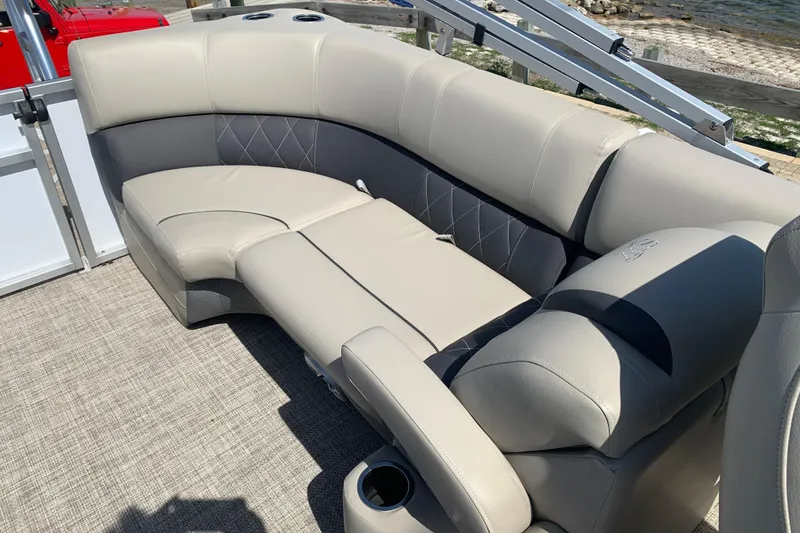 Slide: The Image of 2024 Silver Wave 2210CLS boat interior with luxurious beige seating and cup holders. - 7