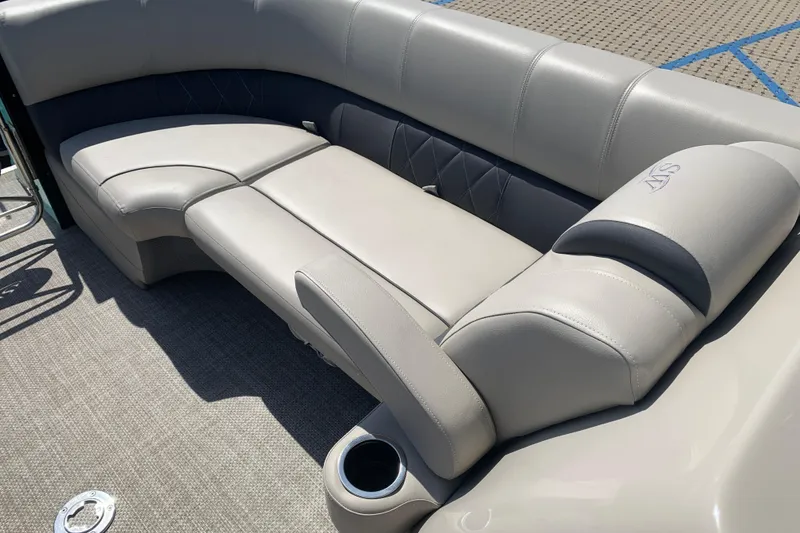 Slide: The Image of Luxurious seating on 2024 Silver Wave 2210CLS boat, featuring plush gray upholstery and cup holder. - 9