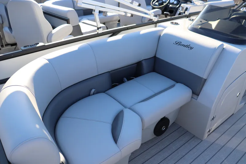 Slide: The Image of 2026 Bentley Pontoons Legacy 203 Navigator interior with luxurious seating and modern design. - 2