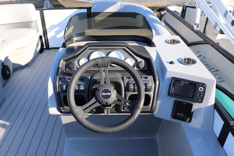 Slide: The Image of 2026 Bentley Pontoons Legacy 203 Navigator dashboard with steering wheel and control panel. - 5