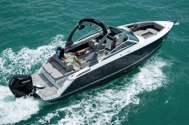 The Image of Manufacturer Provided Image: 2025 Four Winns H6 OB boat cruising on clear blue water. - 0