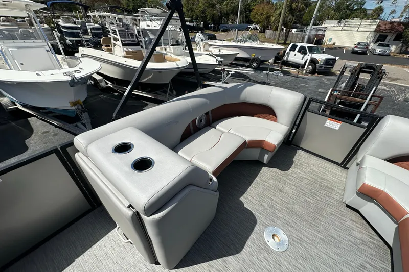 Slide: The Image of 2022 Bennington 22 L Quad Bench pontoon boat with spacious seating and cup holders. - 15