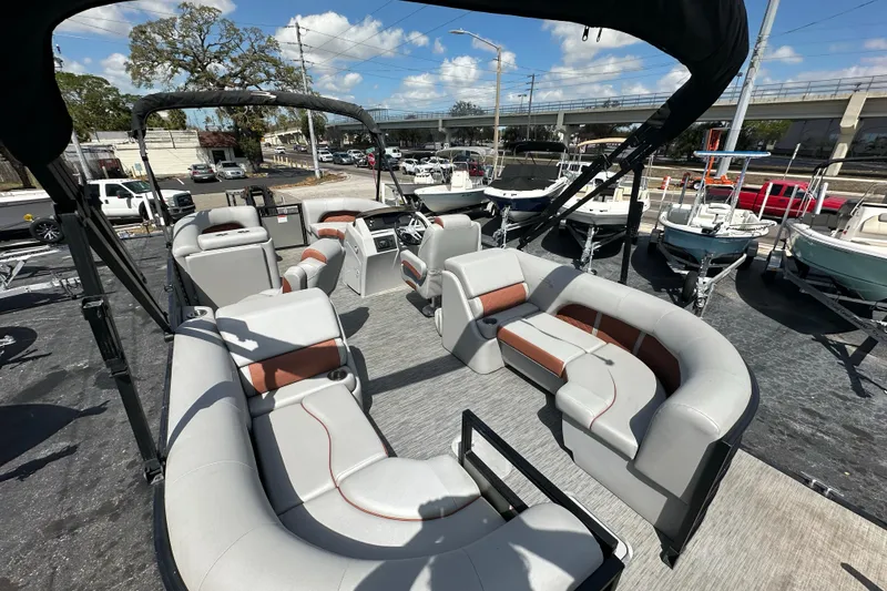 Slide: The Image of 2022 Bennington 22 L Quad Bench pontoon boat with spacious seating and modern design. - 9