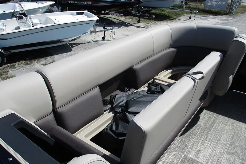 Slide: The Image of 2026 Bentley Pontoons Legacy 240 Cruise interior seating with storage compartments. - 11