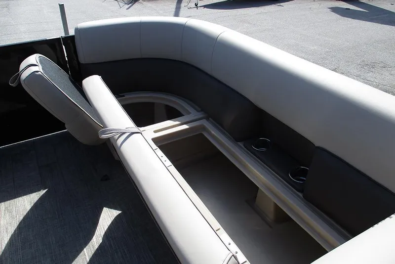 Slide: The Image of 2026 Bentley Pontoons Legacy 240 Cruise interior seating with storage and cup holders. - 16