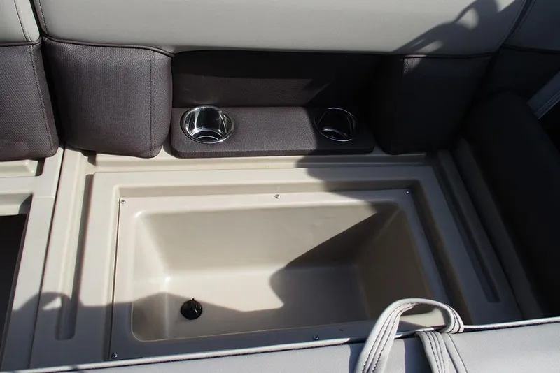 Slide: The Image of 2026 Bentley Pontoons Legacy 240 Cruise interior storage compartment with cup holders. - 22