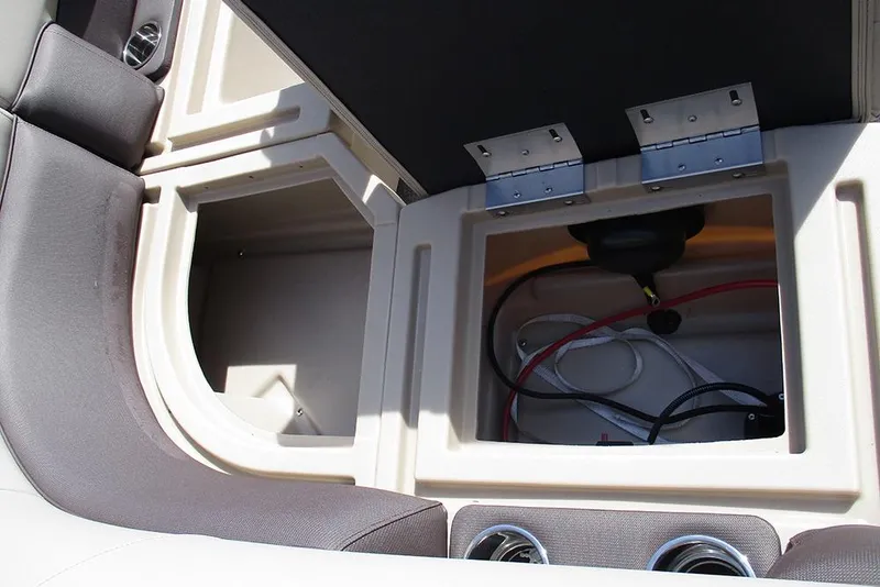 Slide: The Image of 2026 Bentley Pontoons Legacy 240 Cruise storage compartments with wiring and seating detail. - 23