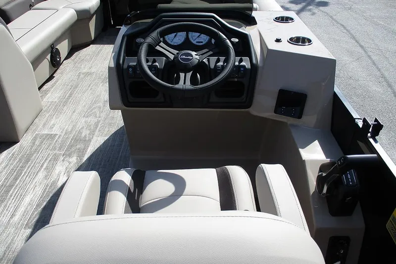 Slide: The Image of 2026 Bentley Pontoons Legacy 240 Cruise interior with steering wheel and seating. - 27