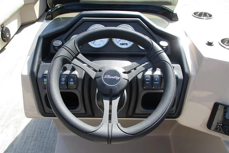 Slide: The Image of Steering wheel and dashboard of 2026 Bentley Pontoons Legacy 240 Cruise boat. - 28