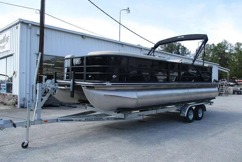 Slide: The Image of 2026 Bentley Pontoons Legacy 240 Cruise on trailer outside dealership. - 3