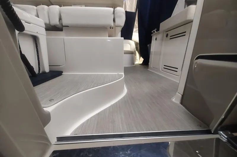 Slide: The Image of 2008 Sea Ray Sundancer 310 interior with modern seating and sleek flooring. - 10