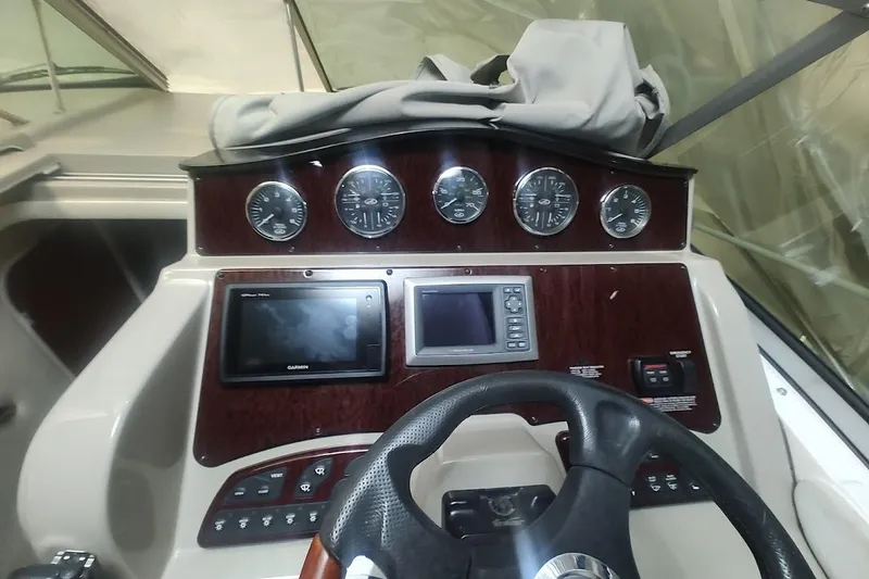Slide: The Image of 2008 Sea Ray Sundancer 310 dashboard with gauges and navigation system. - 18