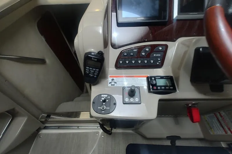 Slide: The Image of Control panel of a 2008 Sea Ray Sundancer 310 boat with navigation equipment. - 19