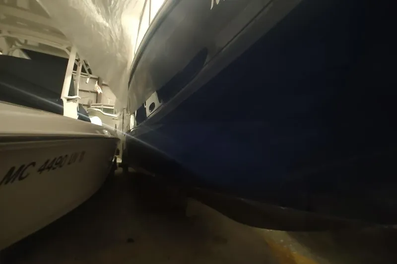 Slide: The Image of 2008 Sea Ray Sundancer 310 docked closely beside another boat in a marina. - 4