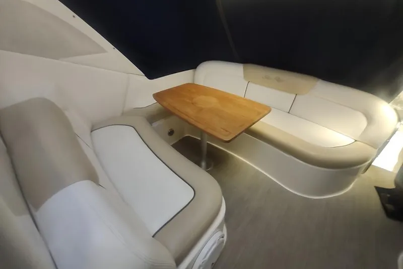 Slide: The Image of Interior of 2008 Sea Ray Sundancer 310 with beige seating and wooden table. - 5