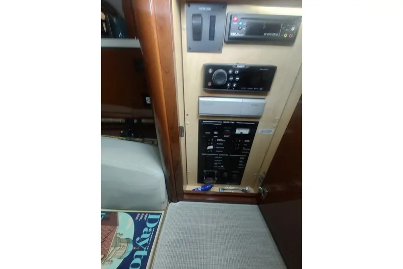 Slide: The Image of Control panel inside 2008 Sea Ray Sundancer 310 yacht cabin, featuring various electronic systems. - 9