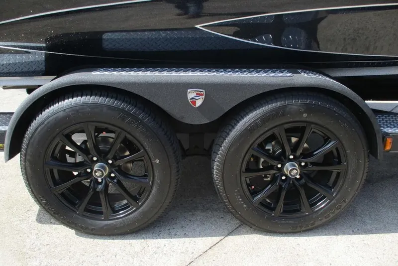 Slide: The Image of 2025 Triton 20XP trailer with black alloy wheels and dual axles. - 10