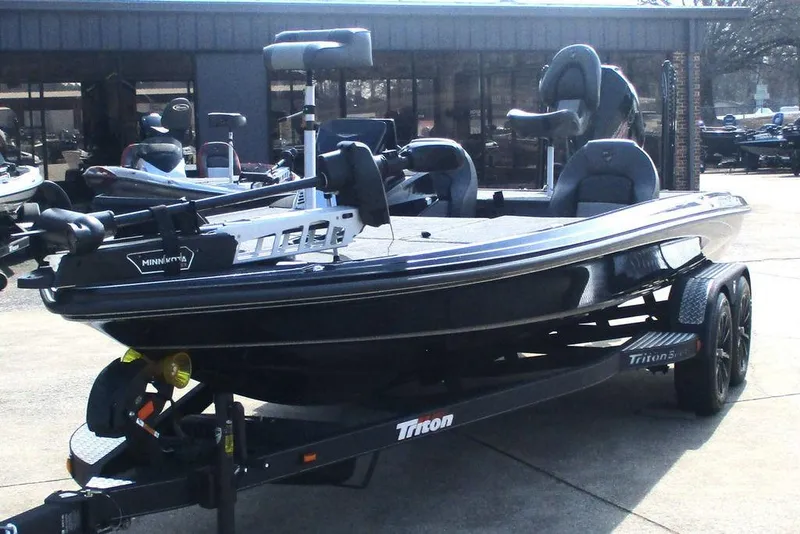 Slide: The Image of 2025 Triton 20XP boat on trailer, featuring sleek design and modern equipment. - 5