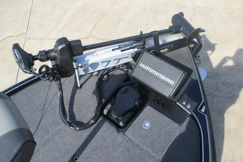 Slide: The Image of Triton 20XP 2025 boat deck with Humminbird fish finder and trolling motor. - 9