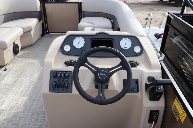 Slide: The Image of 2026 Bentley Pontoons LE 180 Cruise dashboard with steering wheel and control panel. - 5