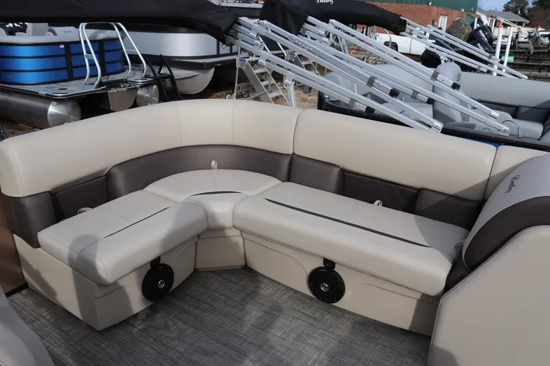 Slide: The Image of 2026 Bentley Pontoons LE 180 Cruise interior with beige seating and modern design. - 6