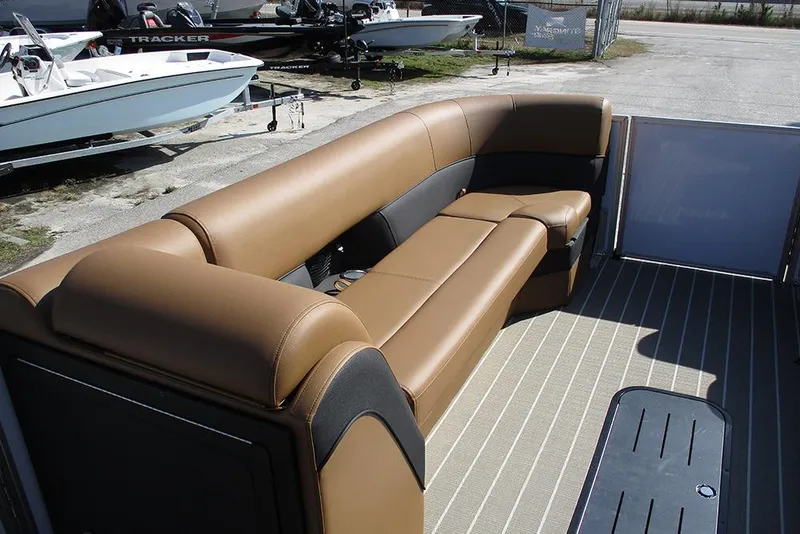 Slide: The Image of 2026 Bentley Pontoons Elite 253 Swingback interior with tan seating and striped flooring. - 11