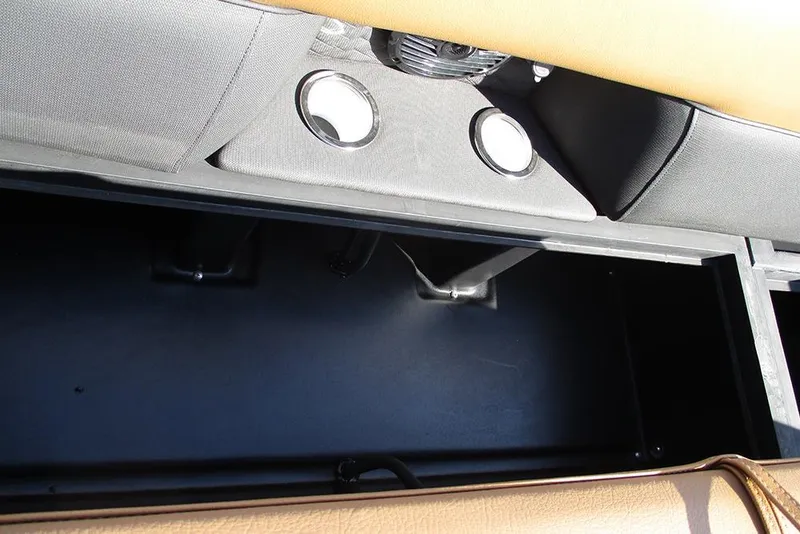 Slide: The Image of 2026 Bentley Pontoons Elite 253 Swingback interior storage compartment detail. - 13