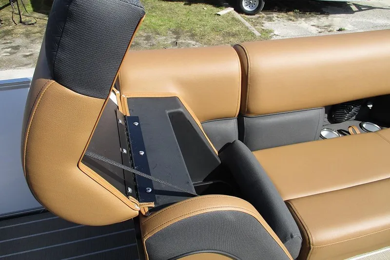 Slide: The Image of 2026 Bentley Pontoons Elite 253 Swingback seat detail with storage compartment open. - 15