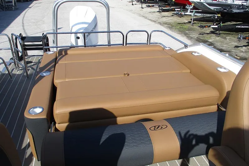 Slide: The Image of 2026 Bentley Pontoons Elite 253 Swingback Tritoon with tan seating and sleek design. - 20