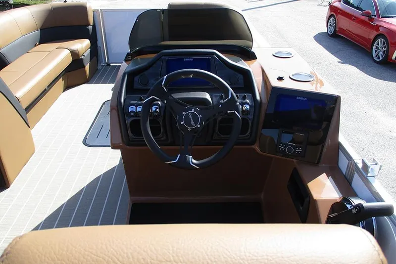 Slide: The Image of 2026 Bentley Pontoons Elite 253 Swingback Dual Captain Full Tritoon interior with steering and seating. - 21