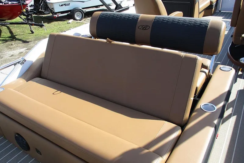 Slide: The Image of 2026 Bentley Pontoons Elite 253 Swingback Dual Captain Full Tritoon, featuring luxurious tan seating. - 26
