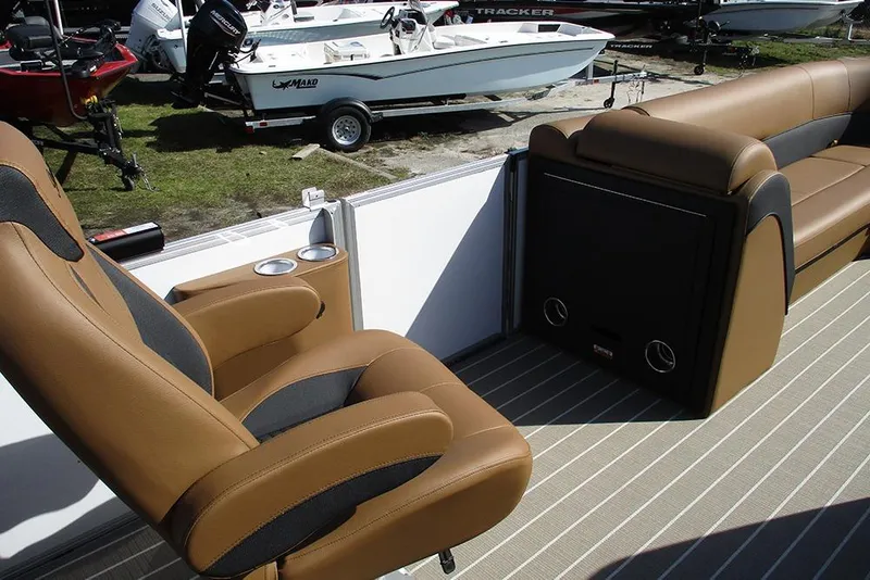Slide: The Image of 2026 Bentley Pontoons Elite 253 interior with dual captain seats and luxurious seating. - 27