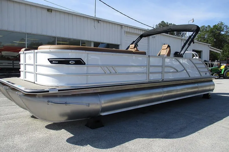 Slide: The Image of 2026 Bentley Pontoons Elite 253 Swingback Dual Captain Full Tritoon, docked outdoors. - 3