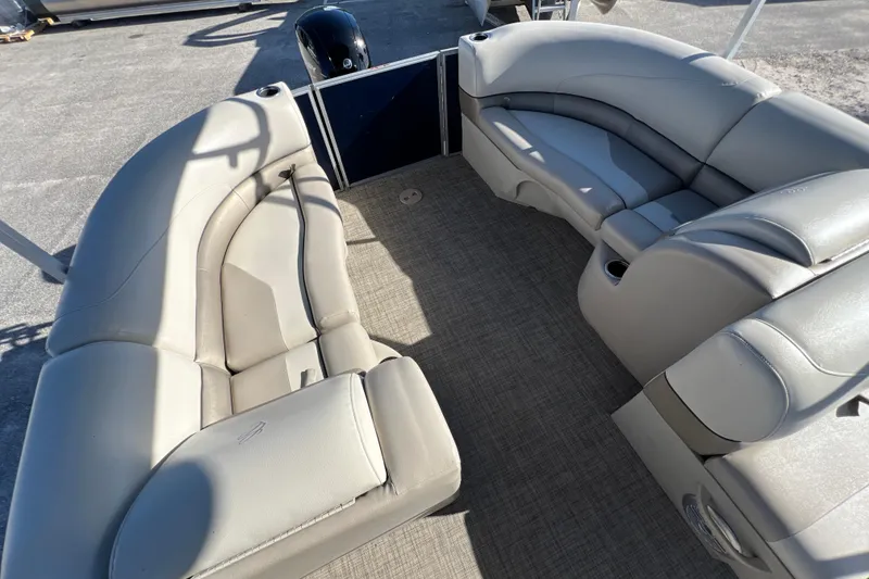 Slide: The Image of 2023 Cypress Cay Seabreeze 232 pontoon boat interior with plush seating and carpeted floor. - 11