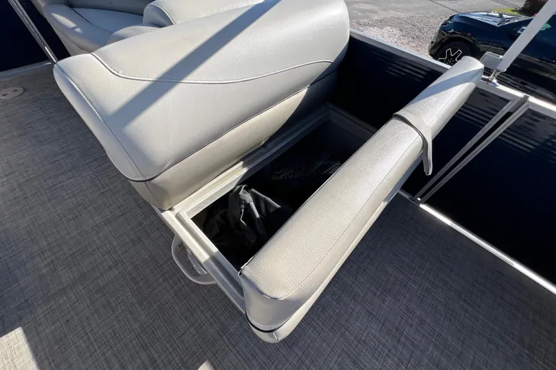 Slide: The Image of 2023 Cypress Cay Seabreeze 232 boat seat with open storage compartment. - 18